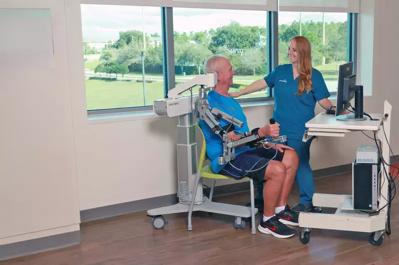 A Provider Helps a Patient with Neurological Physical Therapy