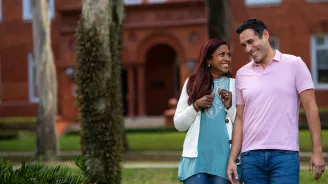 Couple walking in downtown DeLand, Florida.