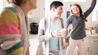 Three women's generations having fun in the kitchen