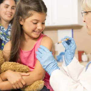 Little girl getting a flu shot