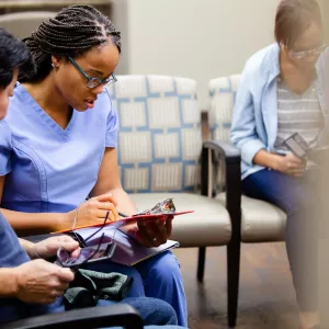 Man talking to nurse in ER