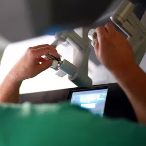 Surgeon using a da Vinci Surgical System.