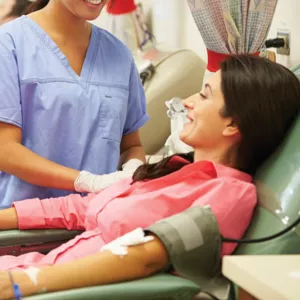 woman preparing to donate blood.