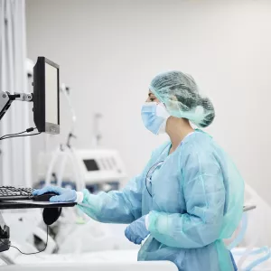 Physician looking at computer