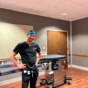 Orthopedic Surgeon Safa Fassihi, MD, stands next to new Hana Table.