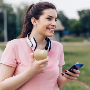 A woman eating an apple.