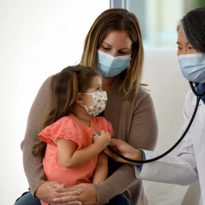 A mother and daughter at a doctor's appointment at AdventHealth.