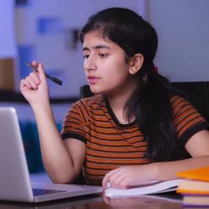 A teenager using her computer.