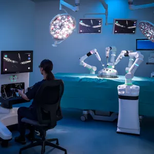 Physician working with Versius equipment