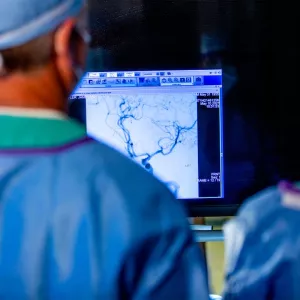 Dr. James Lefler studies a blood clot in a stroke patient