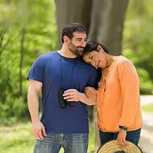 Young Couple hugging and Walking Outside in the woods