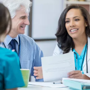 Two physicians interviewing job candidate