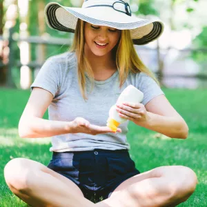 Woman Applying Sunscreen