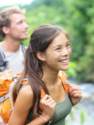 A happy couple hiking.