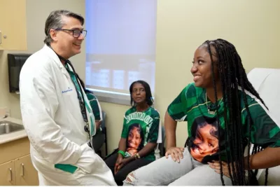 Jermila Pompey, and her family, with Dr. Michael Angelis, at AdventHealth Transplant Institute.