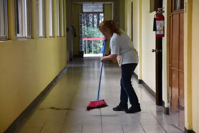An AdventHealth team member sweeps the floor at the malnutrition center in Guatemala.