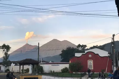 The Volcan de Fuego spits out a plume of ash in Antigua, Guatemala.