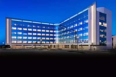 The V-shaped Texas Huguley building at night