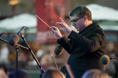 Richard Hickam directs the AdventHealth employee orchestra.