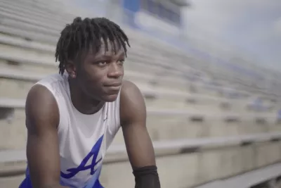 Antonio Parker sits in a stadium