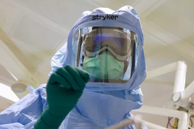 AdventHealth surgical tech, Natasha Francois, dons sterile suit and uses innovative Apple Vision Pro based surgical assist system