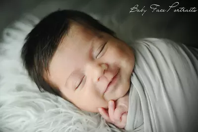 smiling baby sleeping.