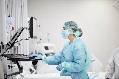 Physician looking at computer