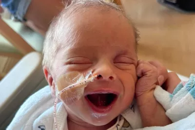 Baby Archer Hanson smiles at the camera from the NICU at AdventHealth Celebration.