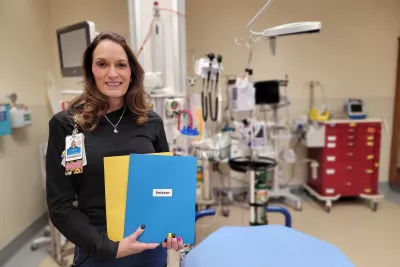 Nurse Heather Foucault stands in a patient room at AdventHealth Parker