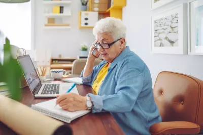 Elderly Woman working from home