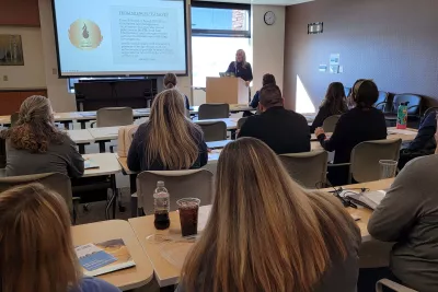 Nurses sit in a training session