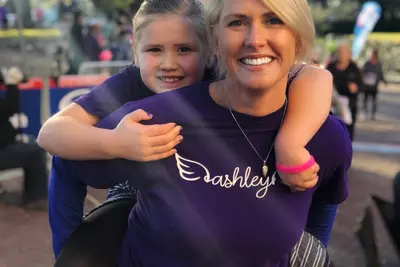 mother and daughter finishing AdventHealth Lady Track Shack 5k