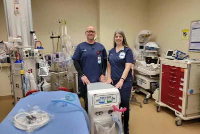 Billy Nolan, RN and Janet Caldwell, RN stand in front of nitrous oxide machine