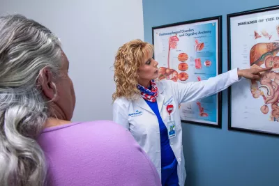 Sharona Ross showing patient diagram at an appointment at the AdventHealth Digestive Health Institute.