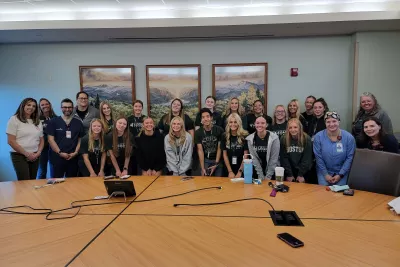 Group of students smiling with nurses