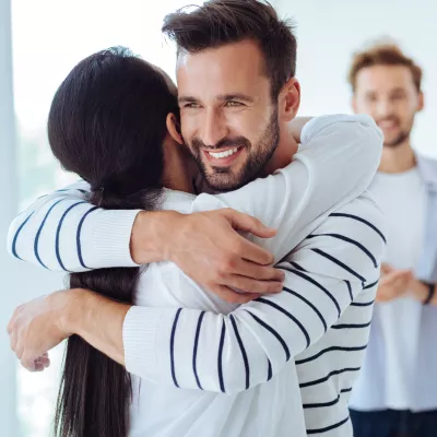 A organ donor hugs someone they helped save with a living donation.