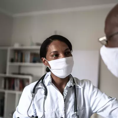 A man visiting his doctor.