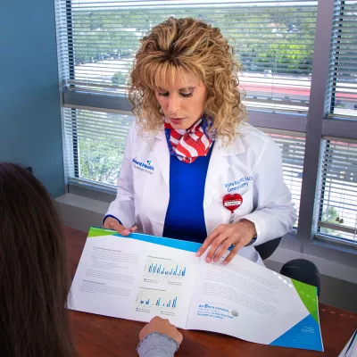 Doctor Sharona Ross and Dana Manzi With patient at an appointment.