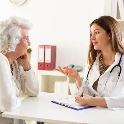 female physician talking to female patient