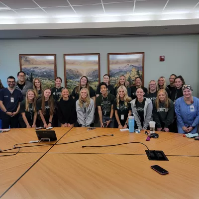 Group of students smiling with nurses