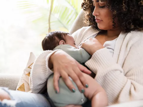 Woman breastfeeding infant