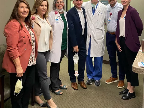 Dr. Girard stands with AdventHealth leadership and physician support team.