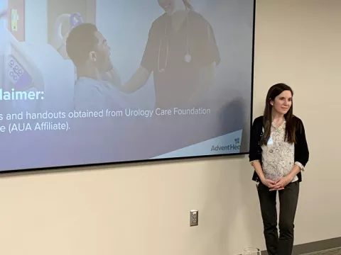 Physician assistant Haley Lawson speaking at a urology dinner on bladder symptoms