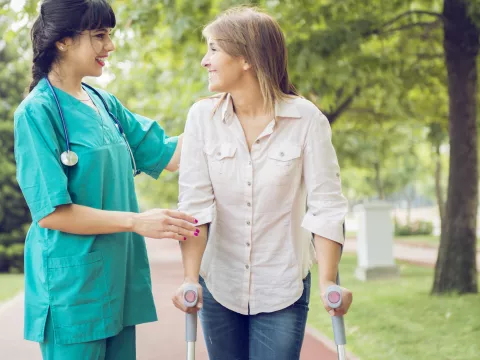 Woman working with a physical therapist