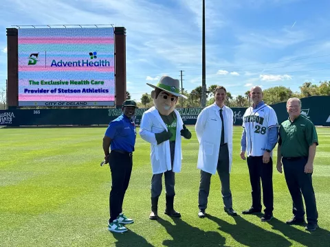 Stetson University President, Chrisopher F. Roellke, PhD and AdventHealth DeLand President and CEO, Eric Lunde are joined by Stetson Athletic Director, Jeff Altier, AdventHealth Athletic Trainer, Larry Bell and Stetson Mascot, John B to official announce an expansion of the two organization’s partnership as AdventHealth becomes the Official Health Care Provider of Stetson University Athletics.