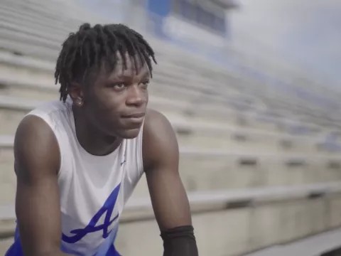 Antonio Parker sits in a stadium