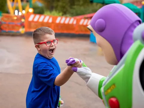 A boy with Buzz Lightyear at Disney's Hollywood Studios.