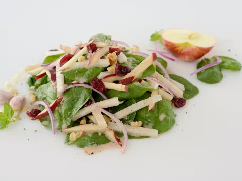 Mound of jicama-apple salad with half apple garnish