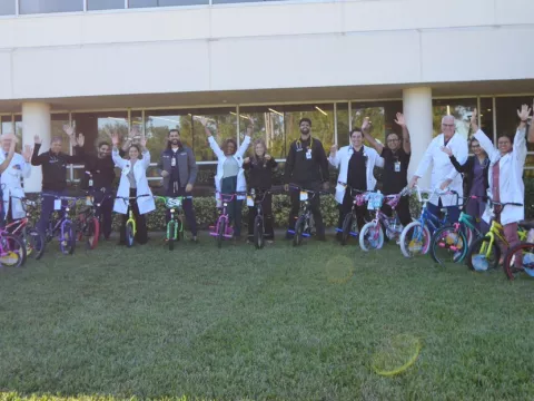 Doctors pose with bikes