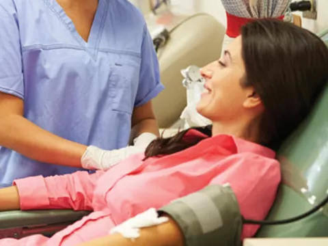 woman preparing to donate blood.